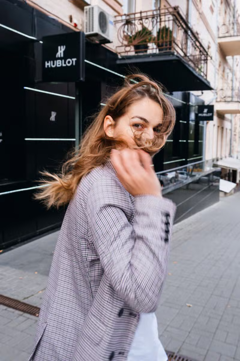 Model wearing modern minimal tailoring in daylight