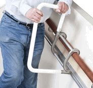 Image of a a man using a moving stair rail