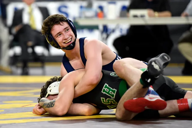 Aaron Ayzerov of Paramus smiles at his coaches as he wins the 152-pound semifinal against Brandon Mooney of Camden Catholic on Day 2 of the NJSIAA State Wrestling Championships at Boardwalk Hall in Atlantic City on Friday, March 6, 2020.