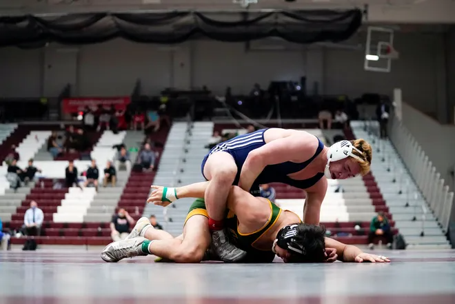 Aaron Ayzerov of Paramus, top, wrestles Sabino Portella of Red Bank Catholic in the 170-pound state final on the second day of the 2021 NJSIAA wrestling championships on Sunday, April 25, 2021, in Phillipsburg, N.J.