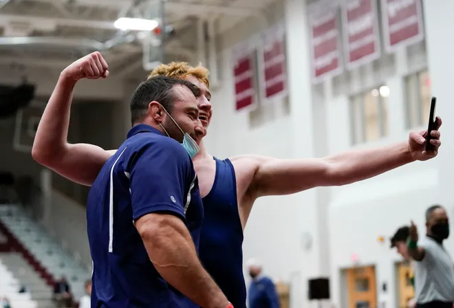 Aaron Ayzerov of Paramus takes a selfie with head coach Chris Falato after winning the 170-pound state final on the second day of the 2021 NJSIAA wrestling championships on Sunday, April 25, 2021, in Phillipsburg, N.J.