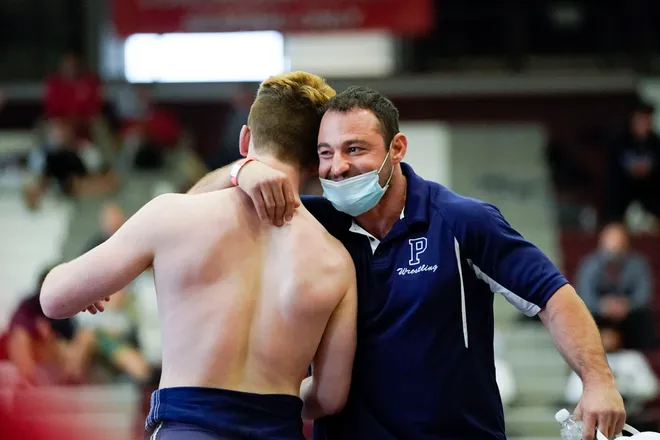Aaron Ayzerov hugs Paramus head coach Chris Falato after winning the 170-pound semifinal bout. The second day of the 2021 NJSIAA wrestling championships on Sunday, April 25, 2021, in Phillipsburg, N.J.