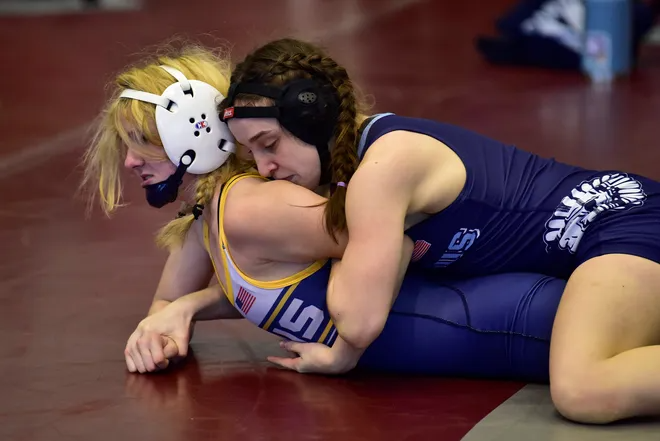 Olivia Klein of Paramus(top) wrestles against Jaclyn McDowell of Gloucester City in the 100 lbs of their semi-final during the Girls Wrestling State Championships at Phillipsburg High School, on Sunday, February 20, 2022.