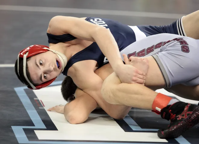 From March 2012: Joe Trovato, top, of Paramus battles Michael Russo, of St. Peters Prep at 106 lbs. during pre-quarterfinal state championship action Friday night in Atlantic City.