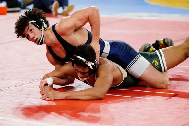Eric Freeman of Paramus, top, and Roberto Padilla of St. Joseph's Montvale wrestle in a 165-pound quarterfinal bout on Day 2 of the NJSIAA state wrestling championships in Atlantic City on Thursday, March 4, 2022.