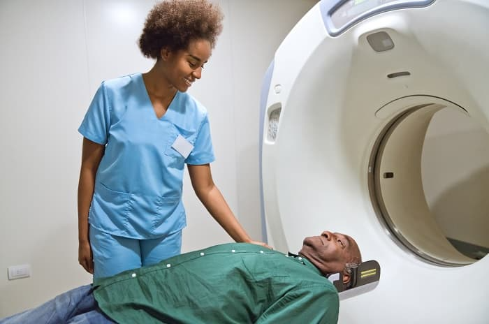 Photo of a man receiving a CT scan