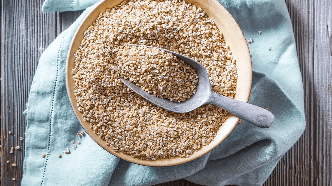 raw steel cut oats in a bowl with scoop