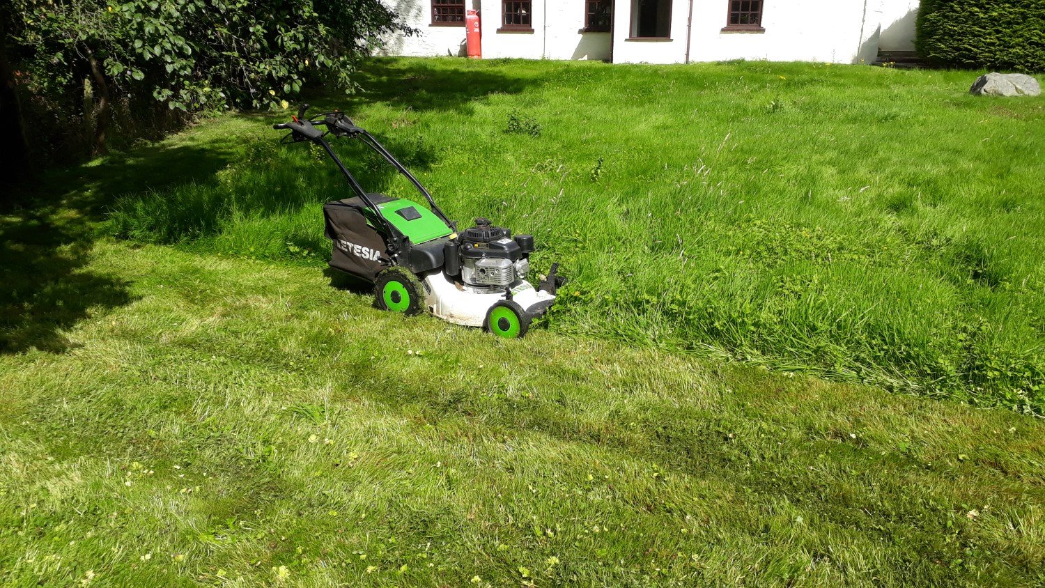 Mowing and collecting long wet grass