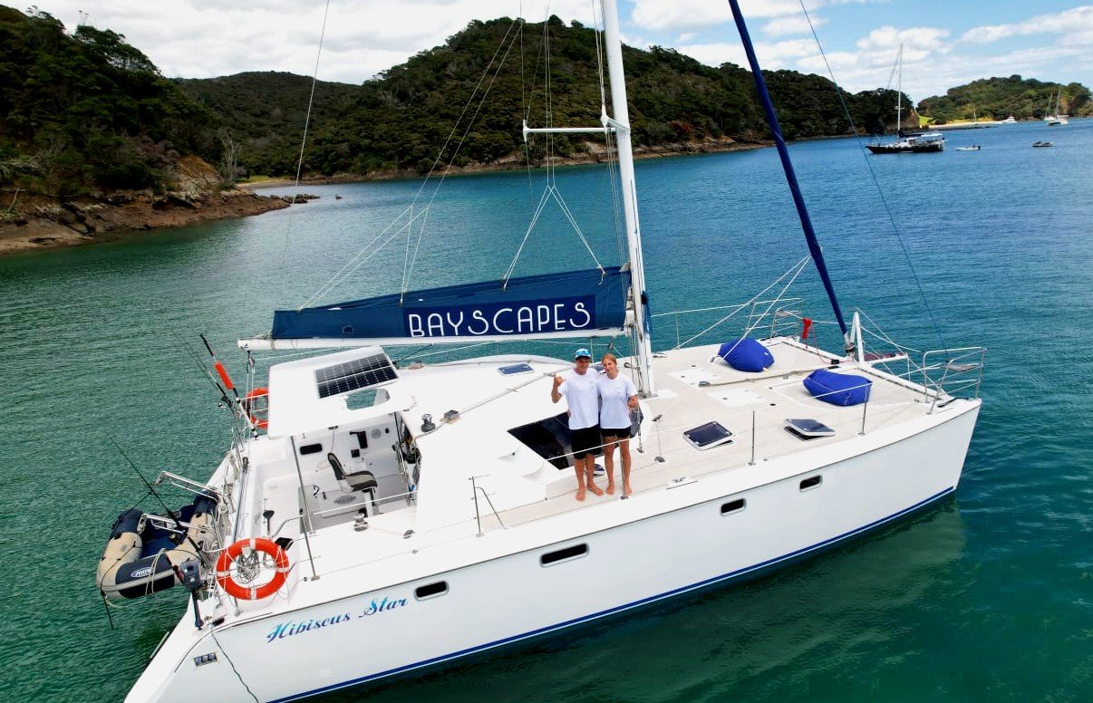 Bayscapes Charters crew on board Hibiscus Star a 40ft (12m) catamaran while anchored at Moturua Bay, Bay of Islands, New Zealand