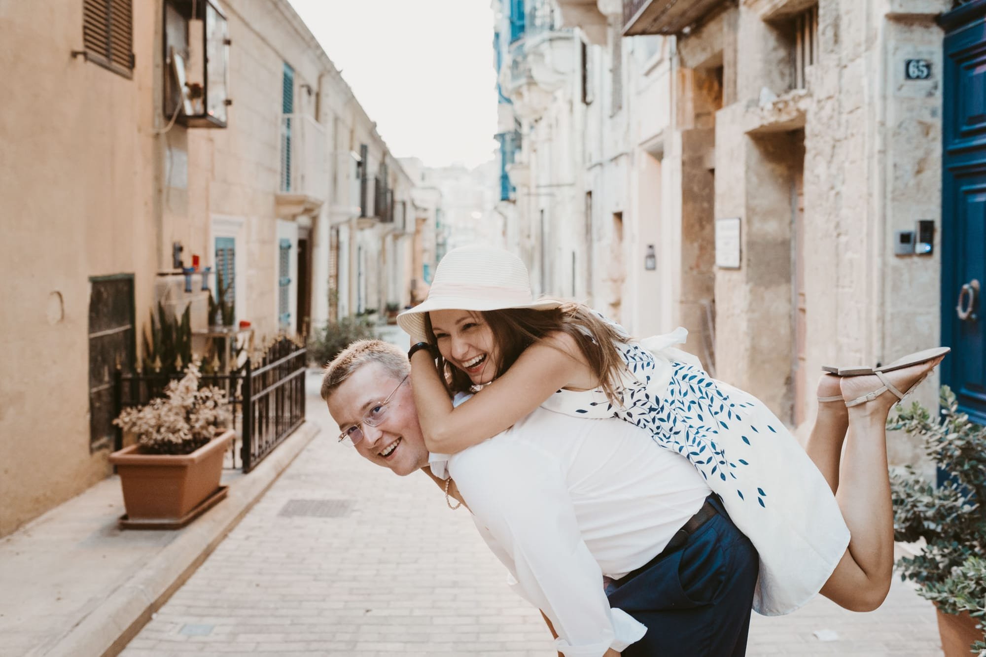 couple at having fun at narrow streets of valletta
