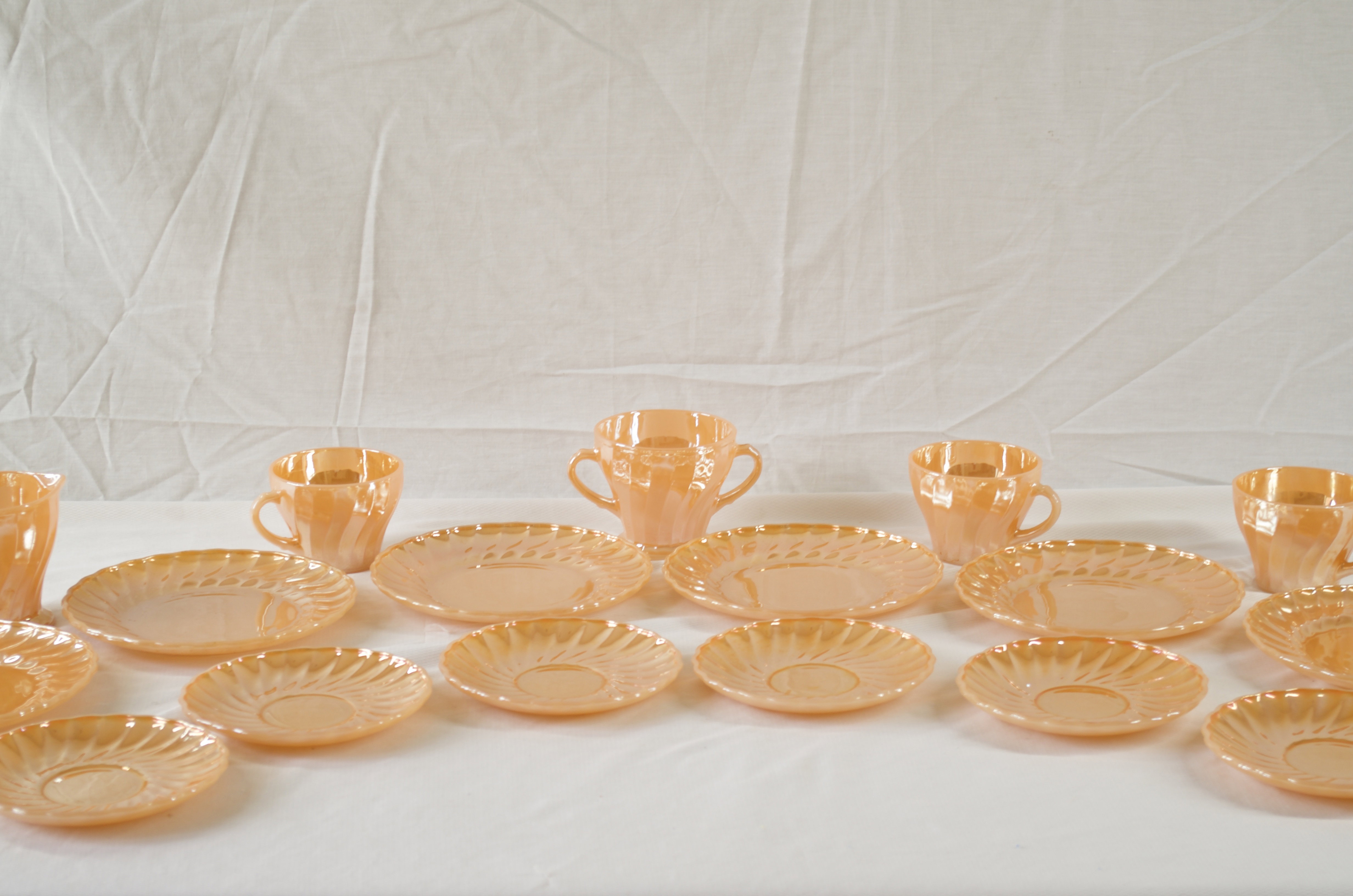 Anchor Hocking Fire King Swivel Tea Set in Royal Peach.