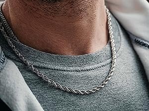 man in grey clothing wearing cuban link chain click image to order