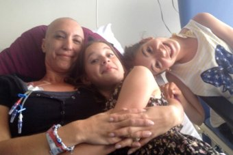 Ms Zorbalas in hospital with her two children
