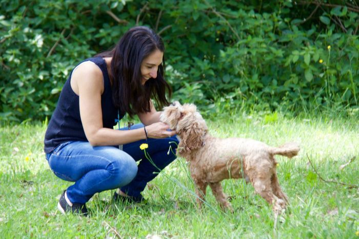 Ms Zorbalas playing with her dog Tiger