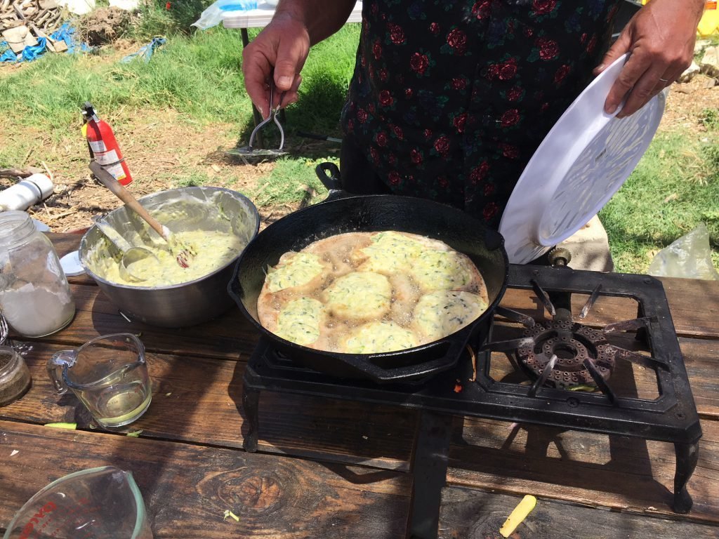 Cooking zucchini-feta pancakes