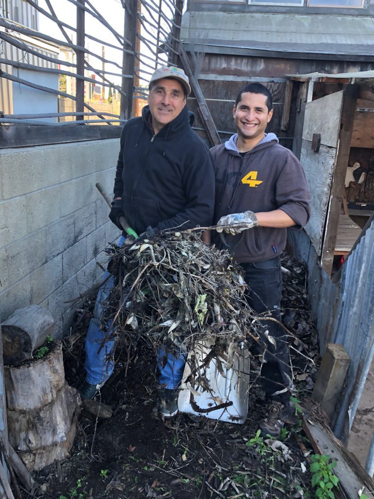 Volunteers Mark Haprov, left, and Wilfredo Rodezno.