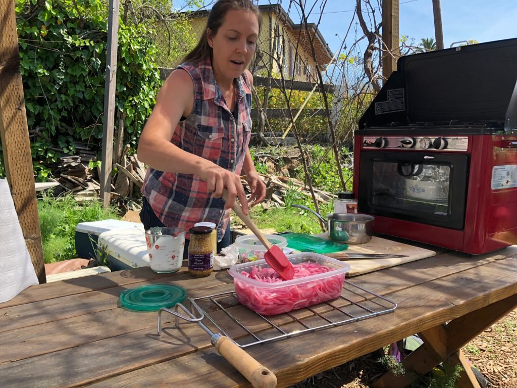 Amanda Aiton making pickled onions.