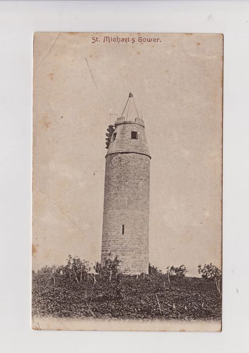 sepia photo of the tower showing an unidentifiable apparatus on top wich seem to stand aprox 10ft high