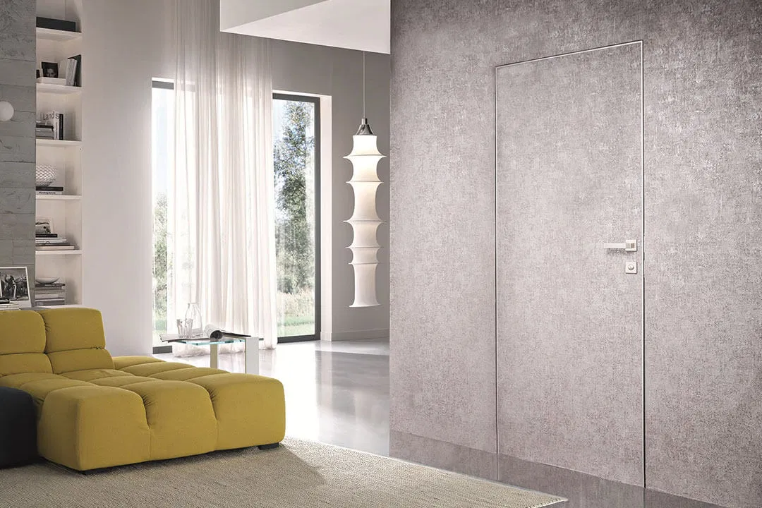 Εσωτερικές πόρτες με κρυφή κάσα αλουμινίου χωνευτή στον τοίχο.