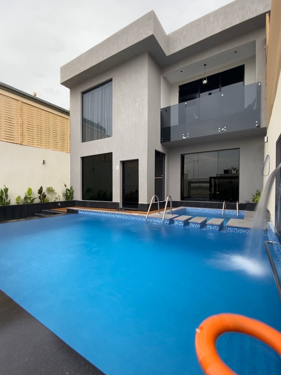 Two-storey chalet with a view of the garden and the pool