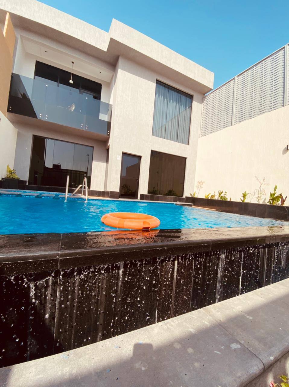 Two-storey chalet with a view of the garden and the pool