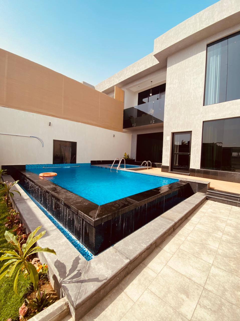 Two-storey chalet with a view of the garden and the pool