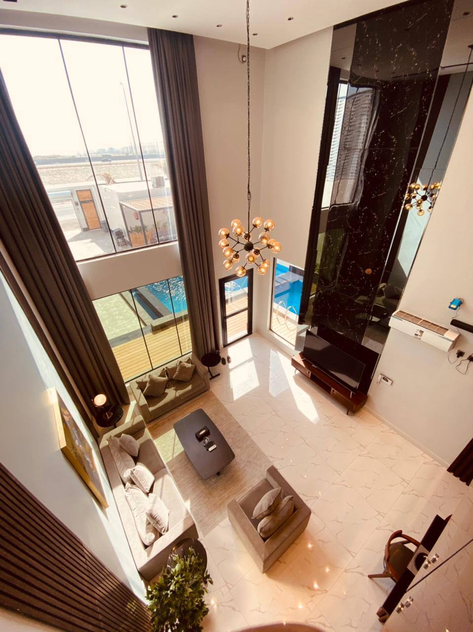 Two-storey chalet with a view of the garden and the pool