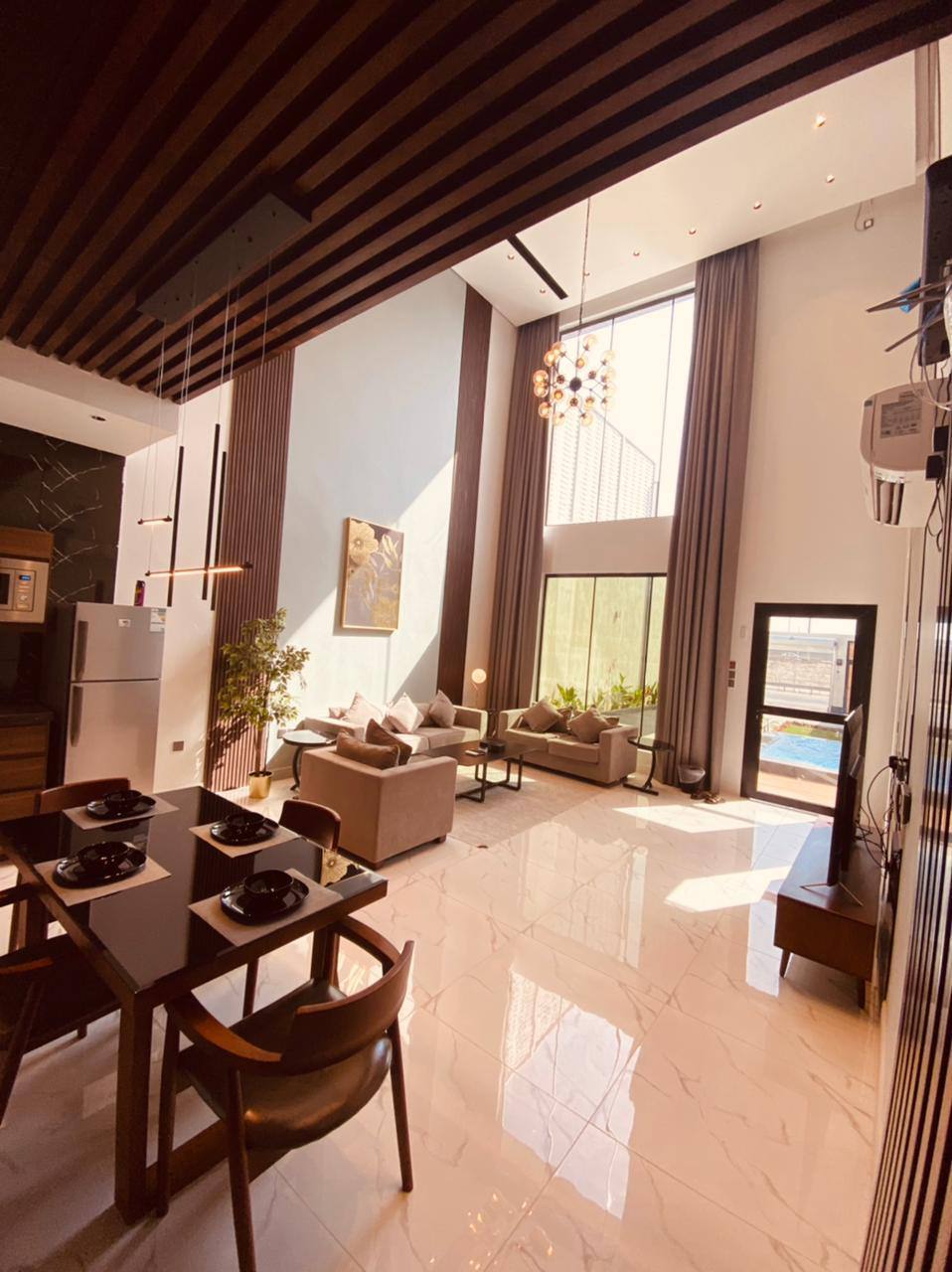 Two-storey chalet with a view of the garden and the pool