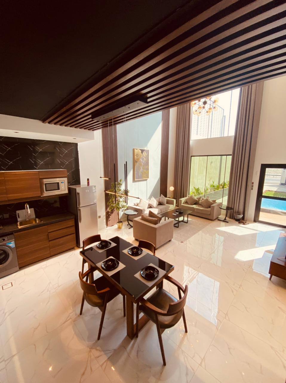 Two-storey chalet with a view of the garden and the pool