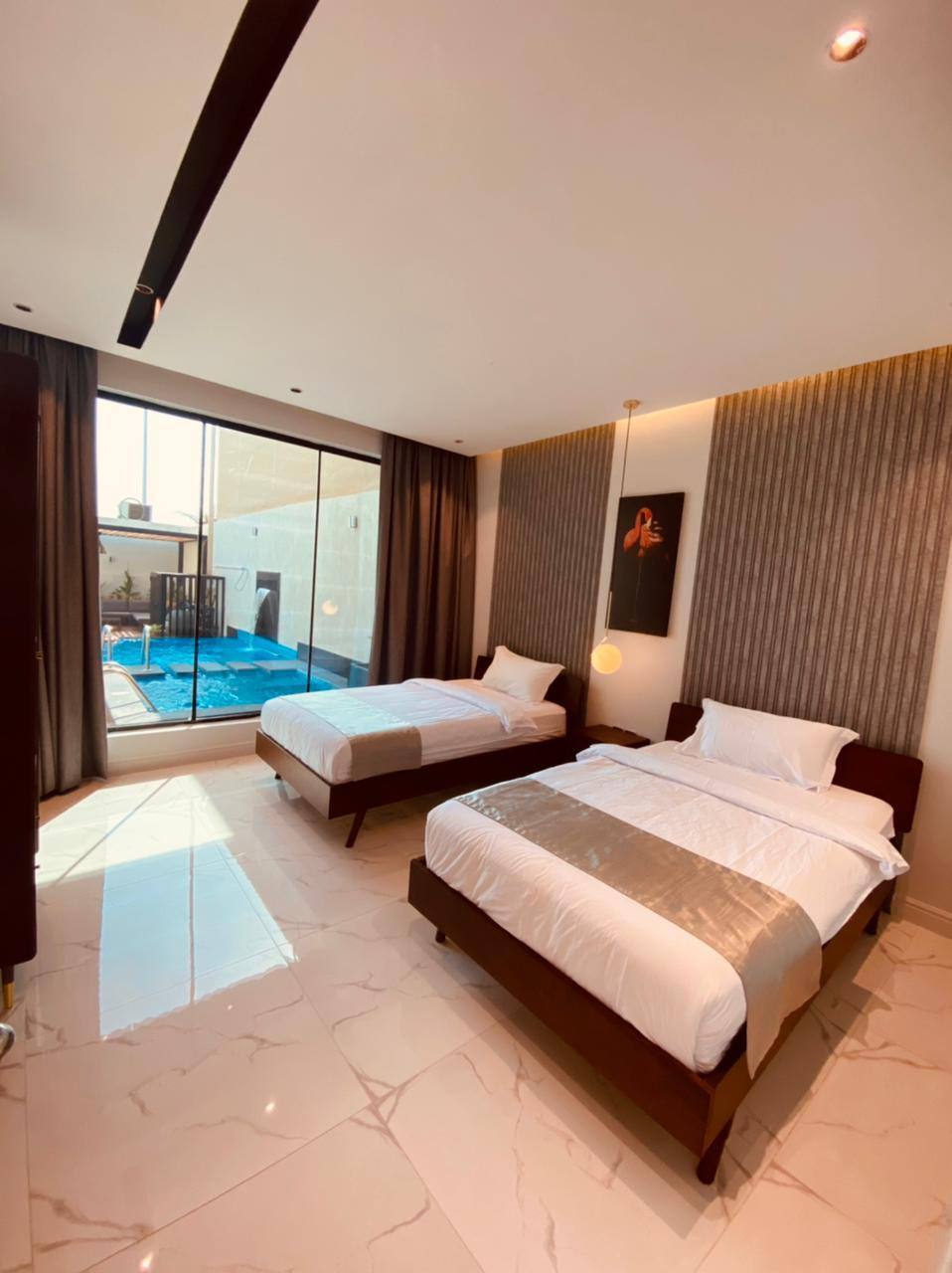 Two-storey chalet with a view of the garden and the pool