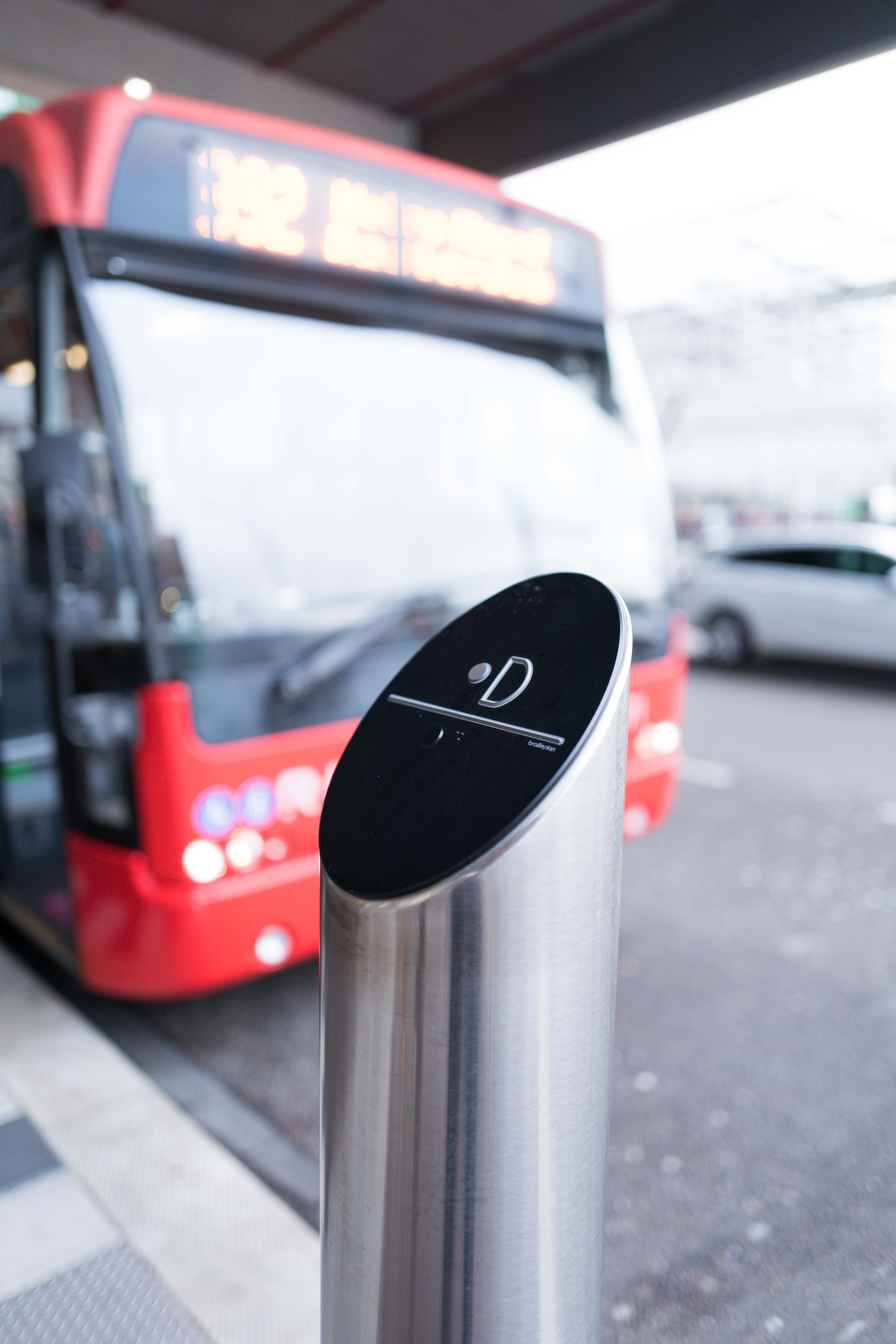Tactile bus stop pole