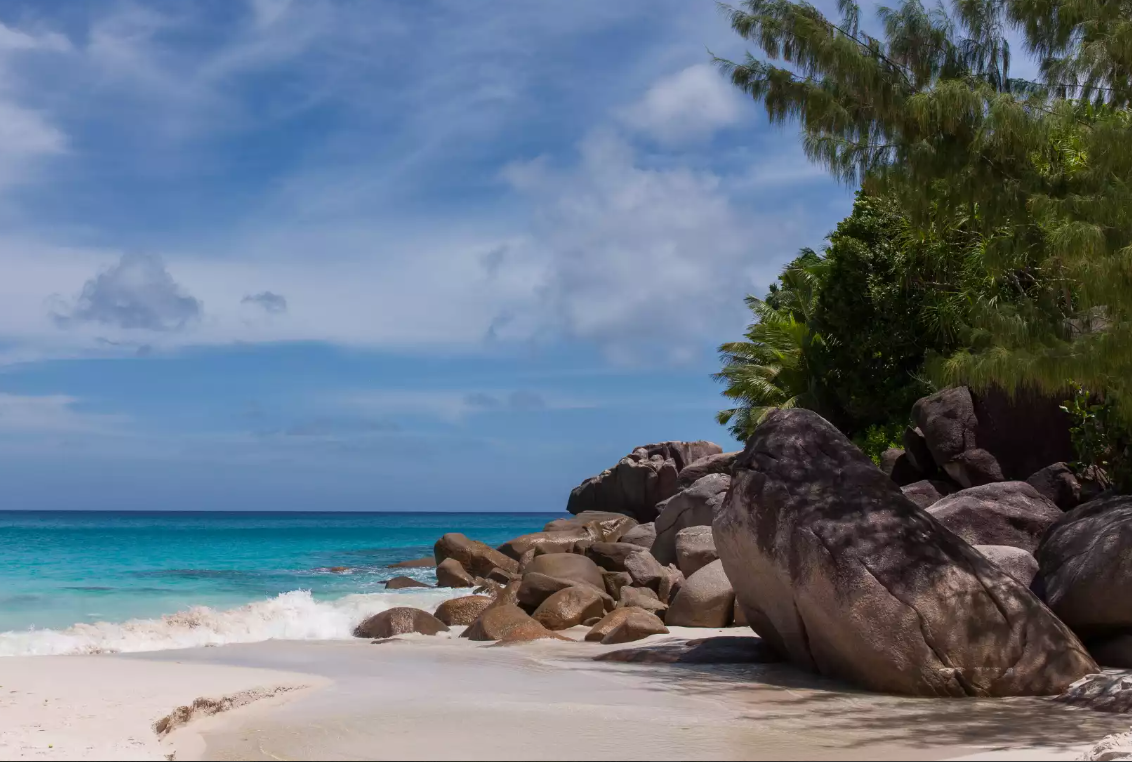 Anse Georgette, Seychelles: A Secluded Haven on Praslin Island. Nestled on the captivating island of Praslin in Seychelles, Anse Georgette is a secluded beach that captivates visitors with its pristine beauty. With crystal-clear waters, powdery white sand, and lush green surroundings, this beach offers a serene escape from the world. Explore the underwater world through snorkeling or simply bask in the sun while enjoying the tranquility of this hidden gem.