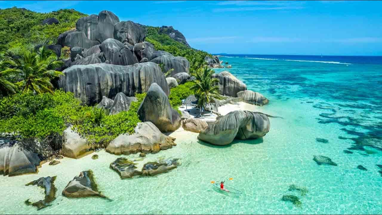 Anse Source d'Argent, Seychelles: A Dreamlike Beauty on La Digue Island. Step into a dreamlike paradise at Anse Source d'Argent on La Digue Island, Seychelles. This secluded beach is known for its stunning granite rock formations, shallow turquoise waters, and secluded coves that create a truly enchanting setting. Take a dip in the crystal-clear waters, explore the underwater world with snorkeling, or simply unwind on the soft sand. Anse Source d'Argent is a hidden gem that will transport you to a world of serenity.