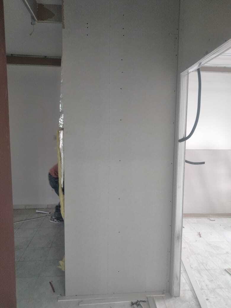 Implementation of decoration works inside a medical clinic in the Al-Rasheed suburb.