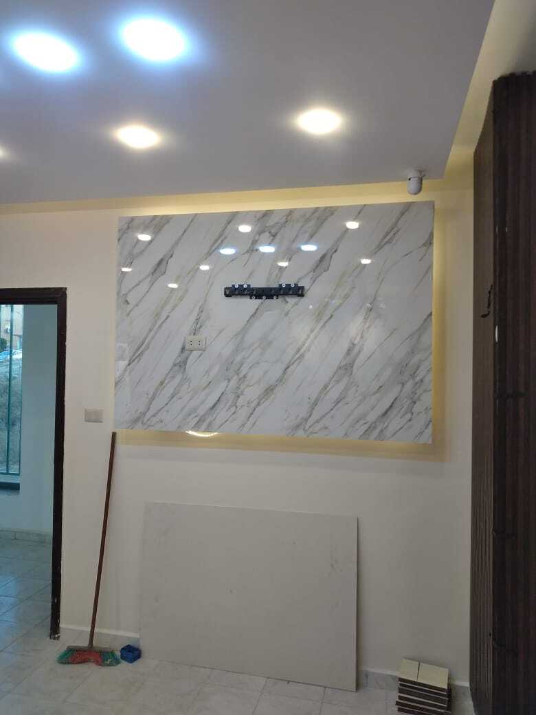 Implementation of decoration works inside a medical clinic in the Al-Rasheed suburb.