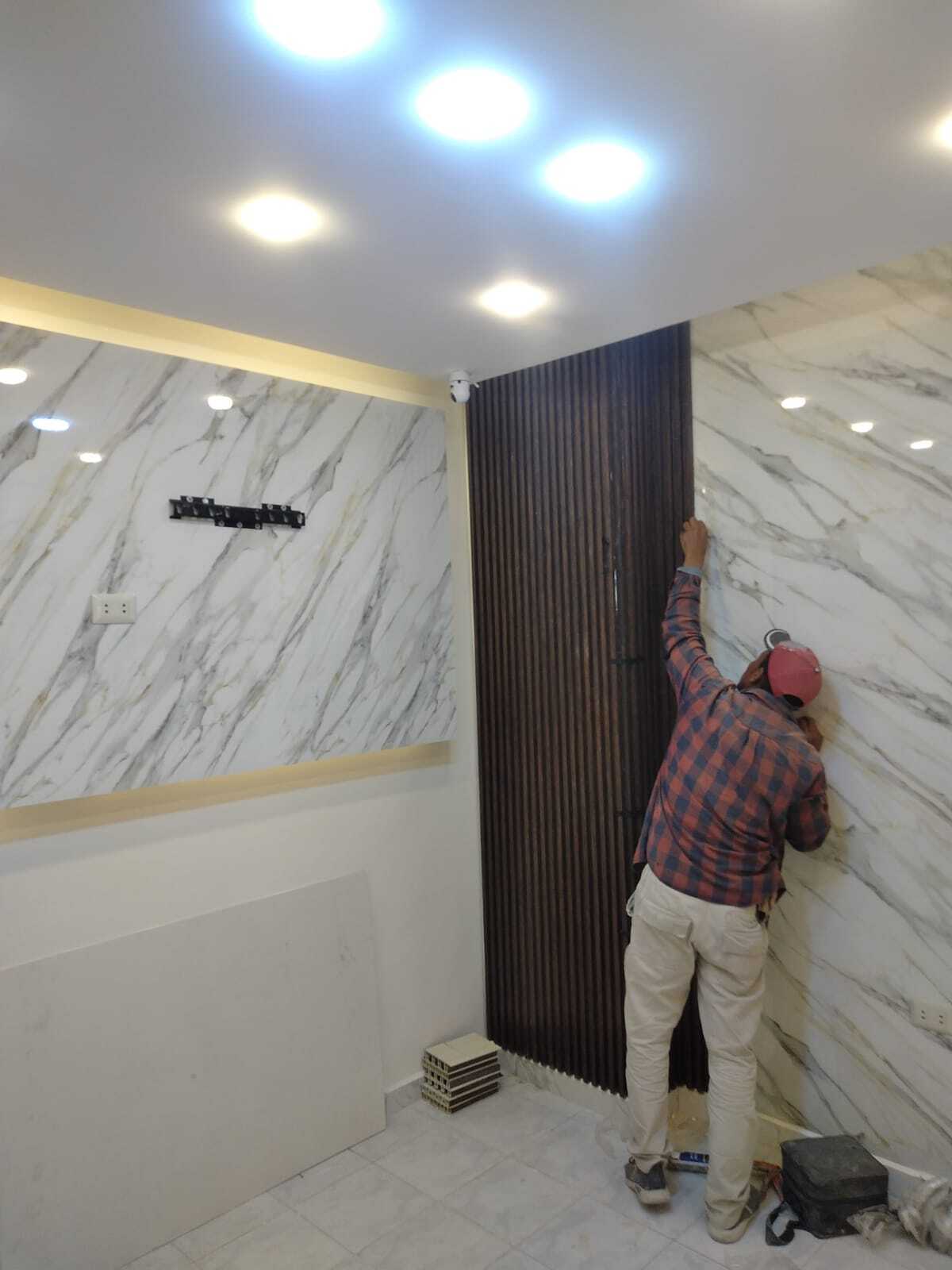 Implementation of decoration works inside a medical clinic in the Al-Rasheed suburb.