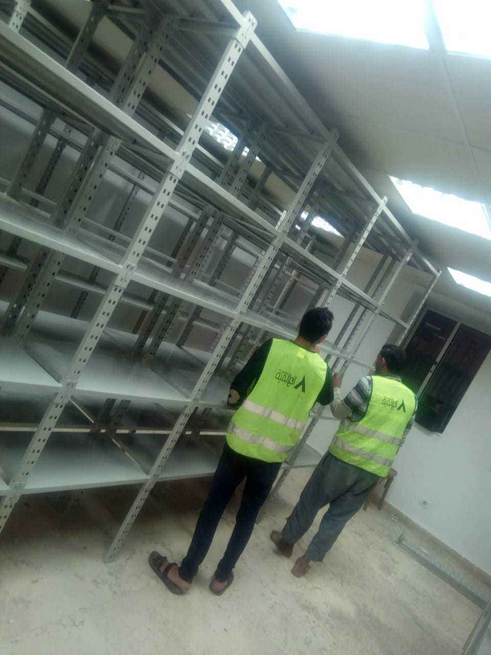 بعض الصور من اعمالنا { تجهيز مخازن }