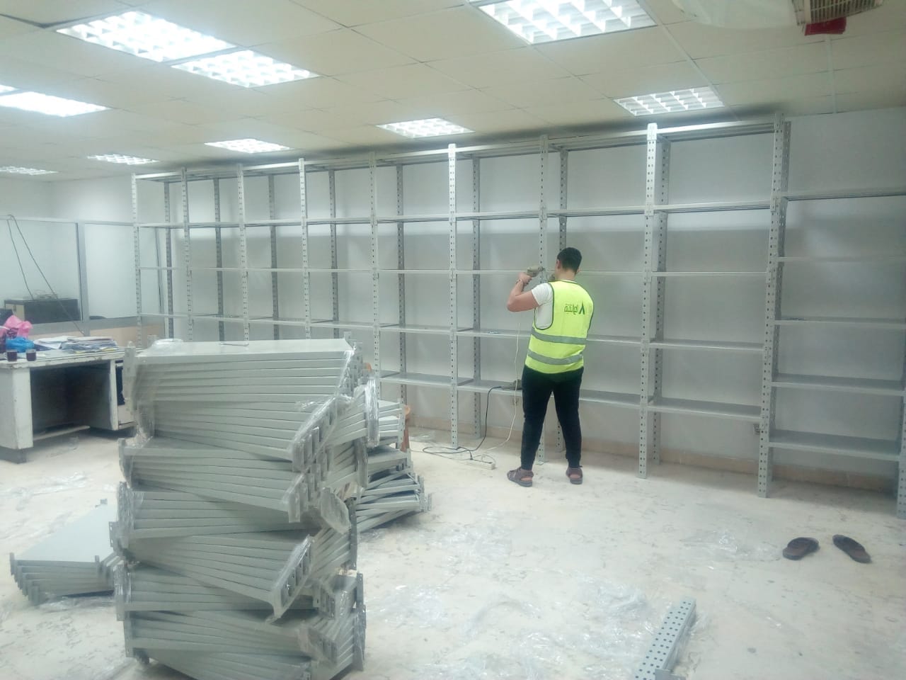 بعض الصور من اعمالنا { تجهيز مخازن }