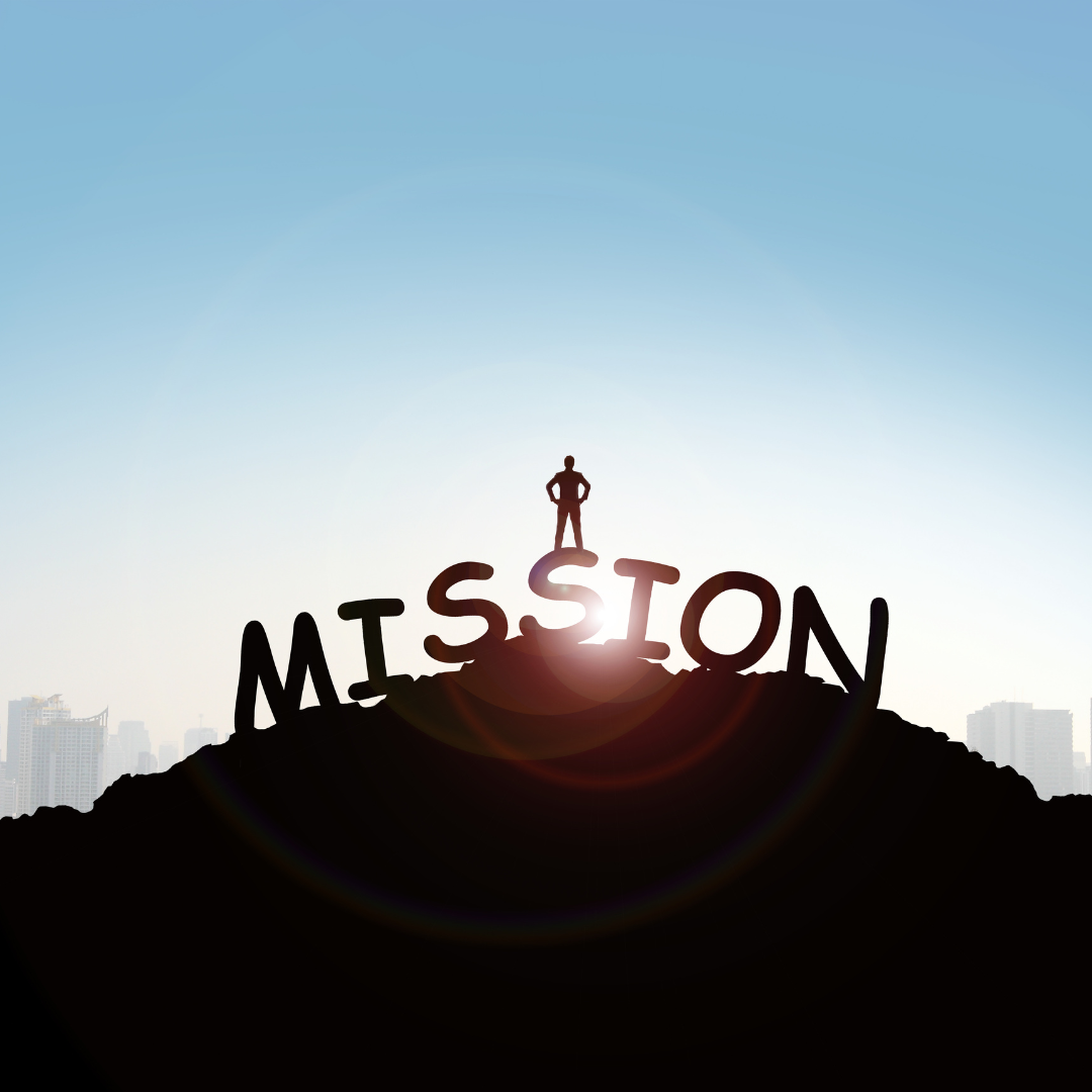 Person standing on top of the word mission