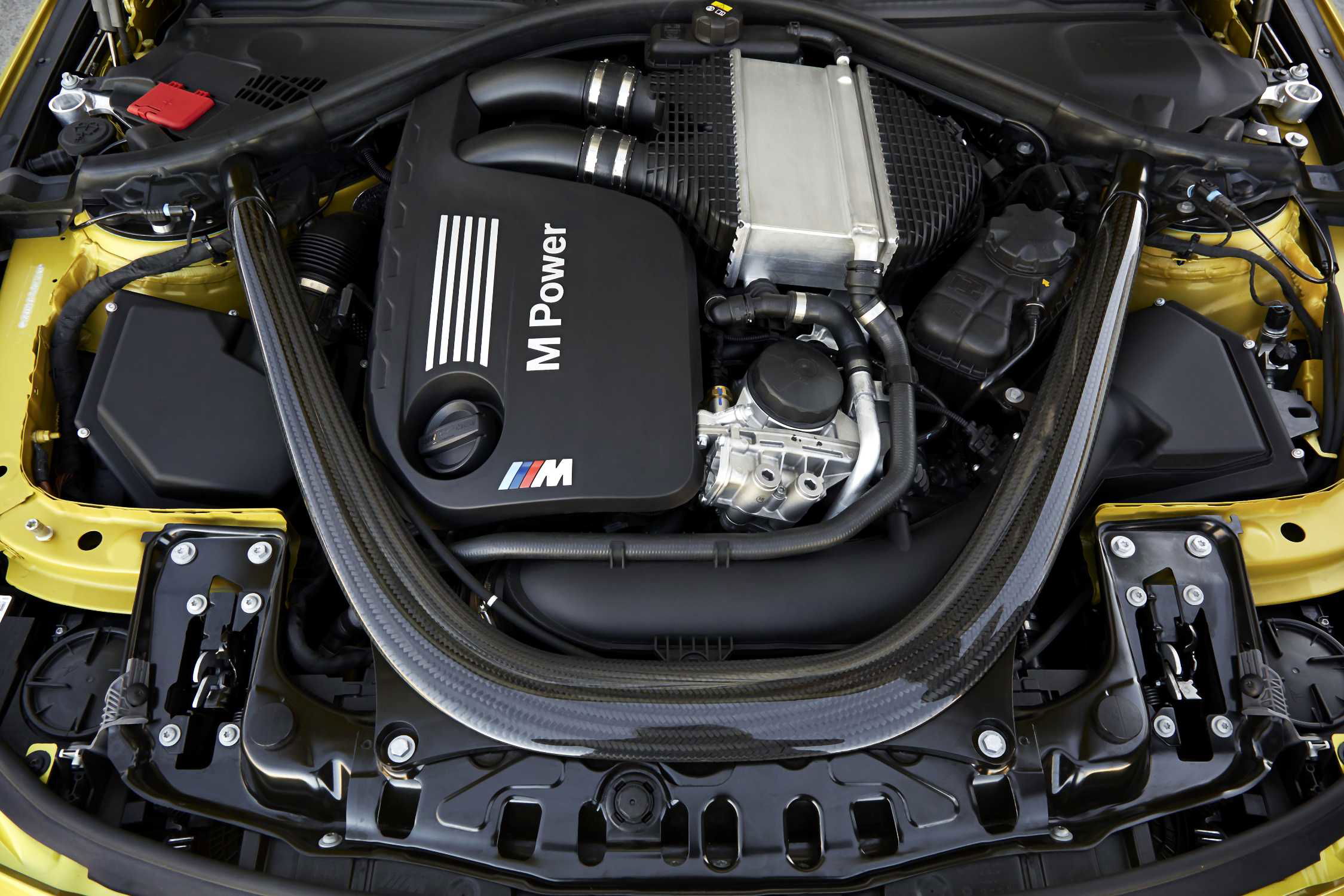 The-new-bmw-m4-coupe engine with-cfrp-precision-strut Via BMW Group PressClub.