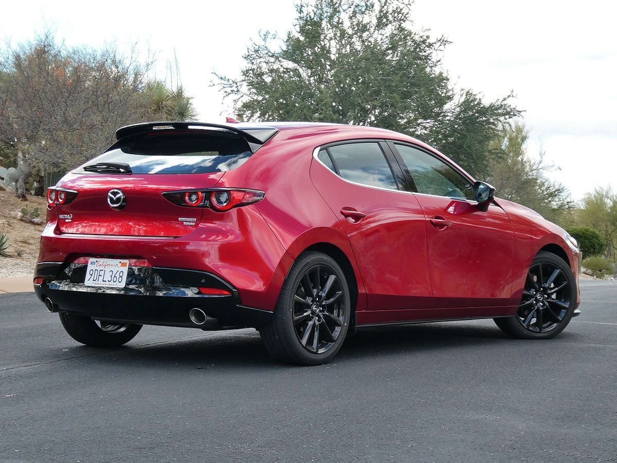 2023 Mazda Mazda3 Hatchback 2_5 Turbo Premium Plus AWD Red Rear Quarter View via JDP.