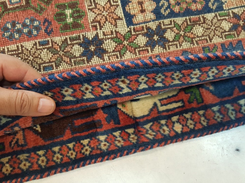 תפירה של קנטים לשטיח פרסי