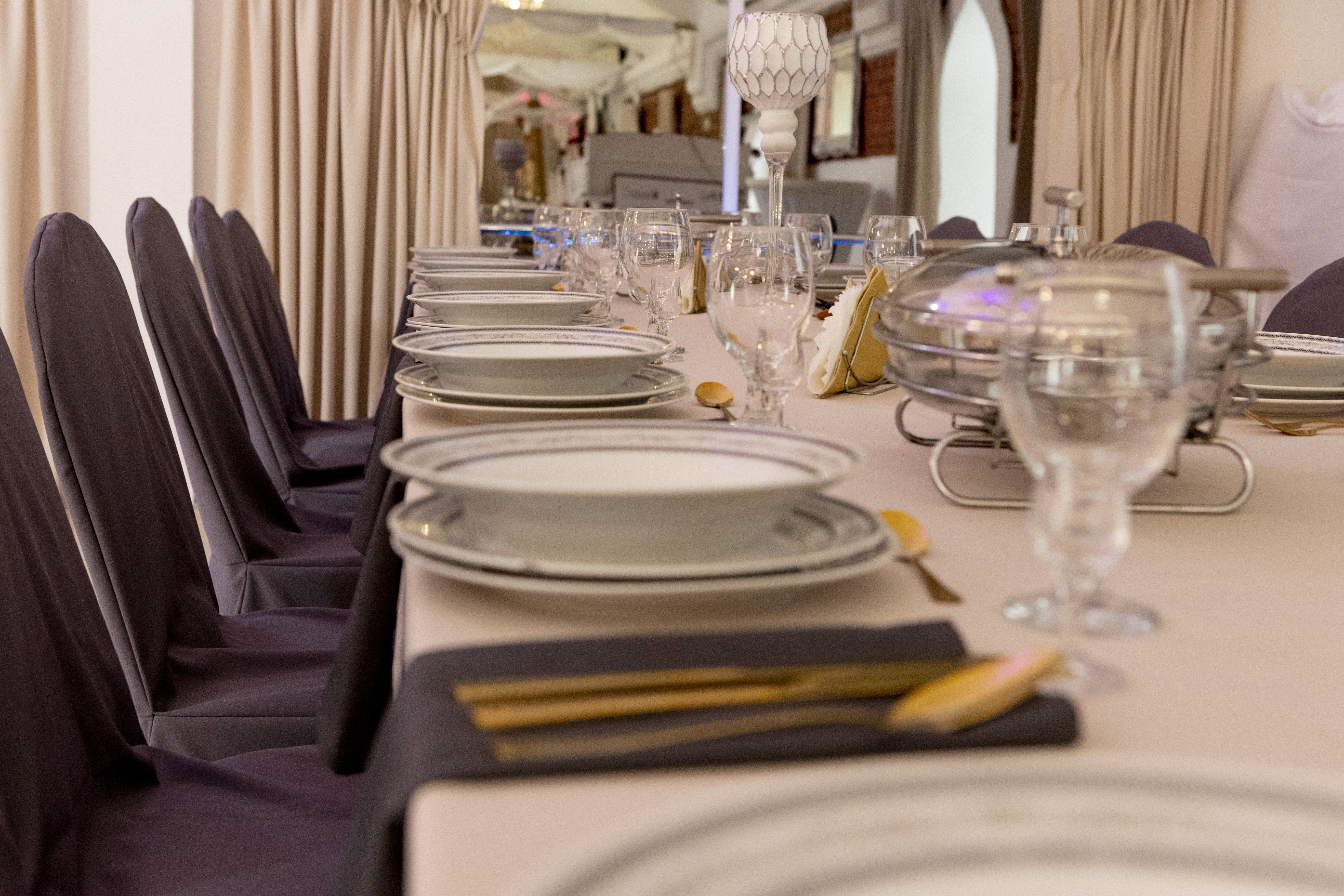 Gold cutlery and round plates.