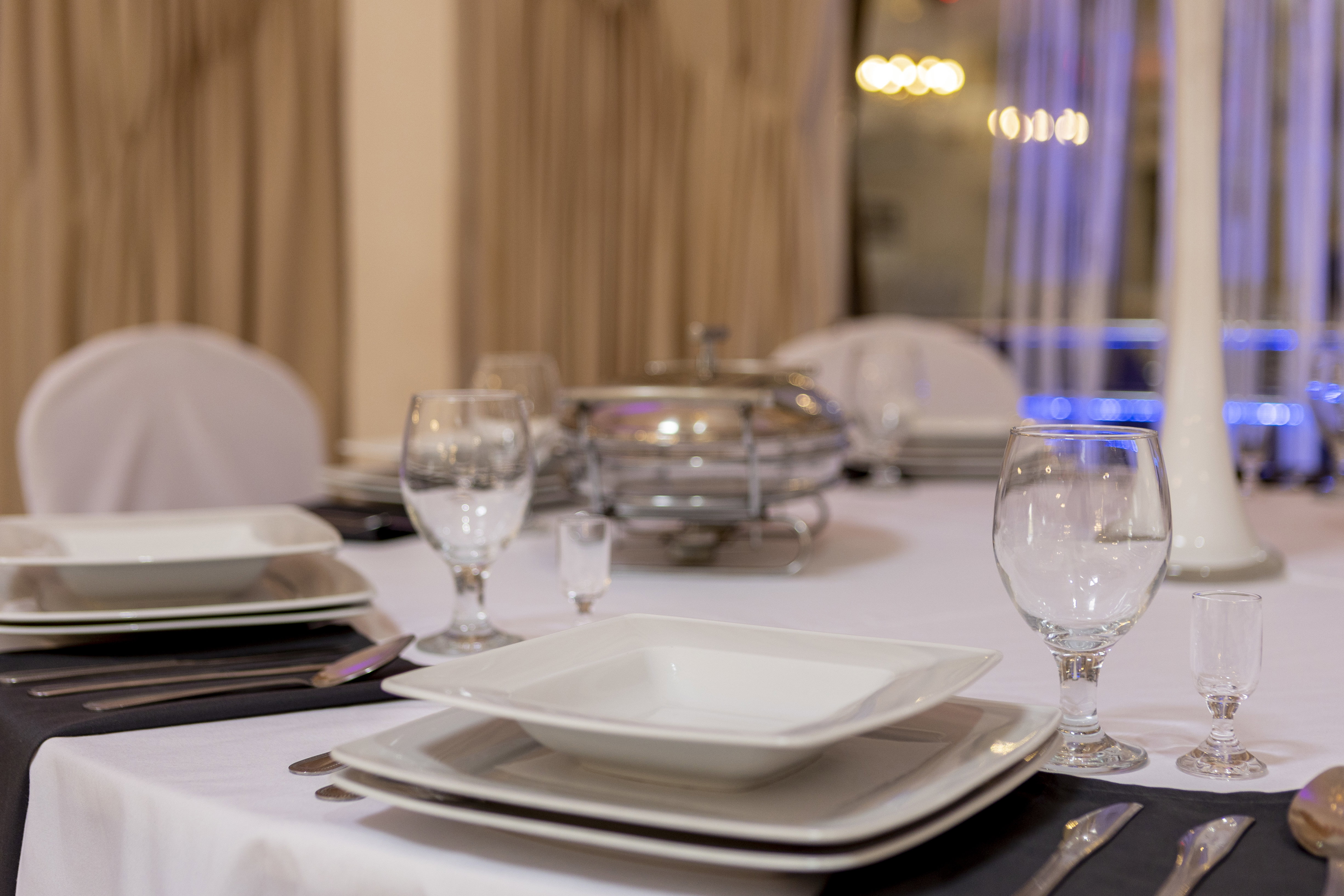 Silver cutlery and square plates.