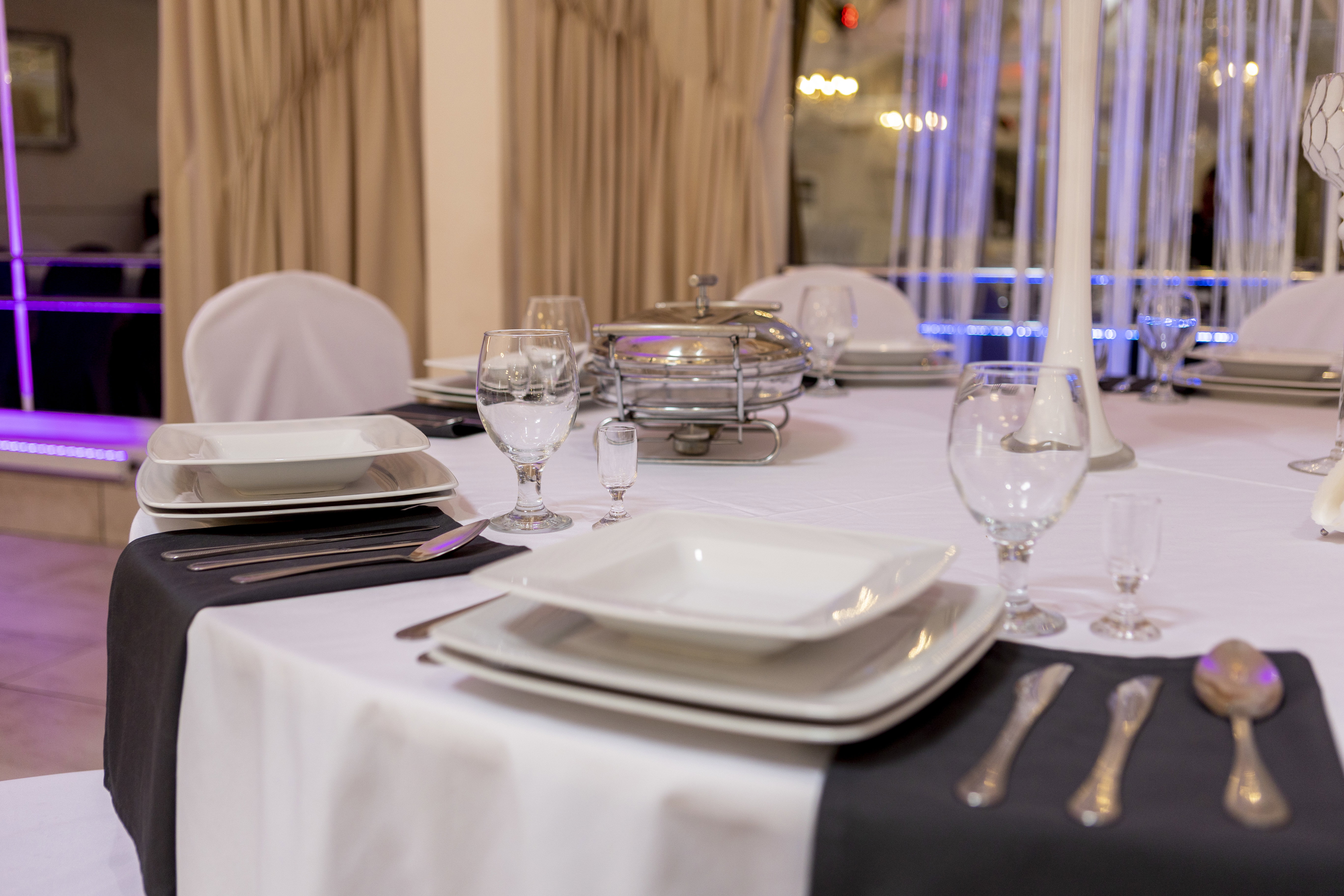 Silver cutlery and square plates.