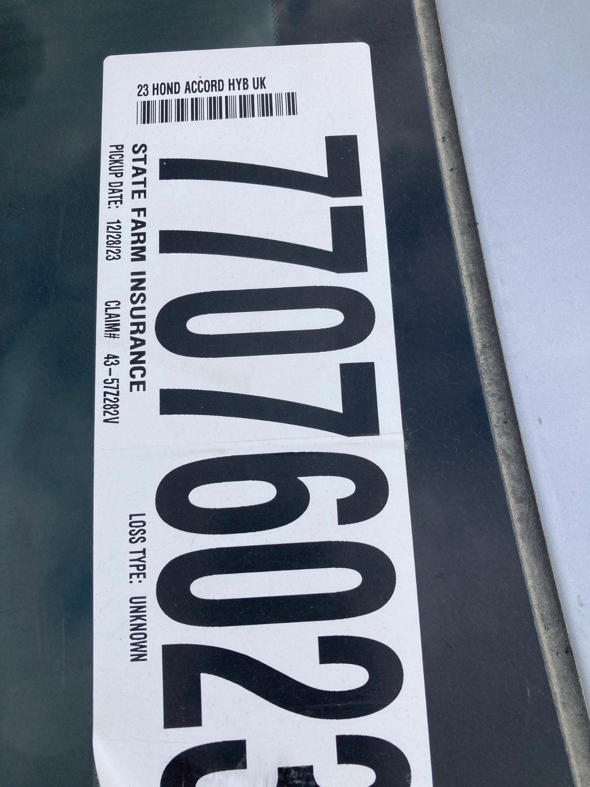 77076023