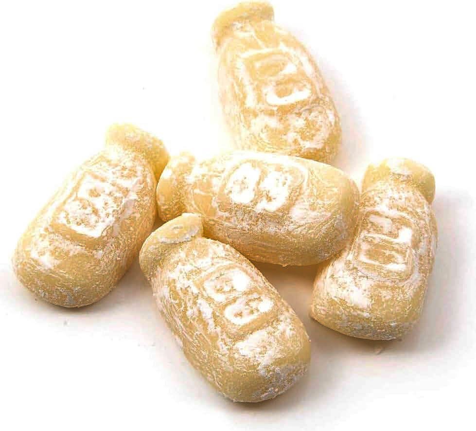 Five loose, dusted milk bottle sweets