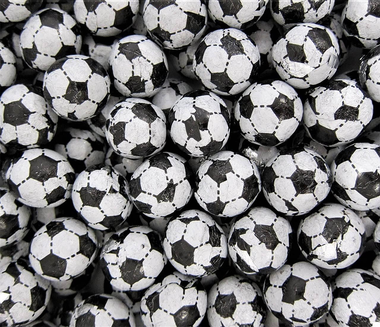 Loose milk chocolate footballs individually wrapped in foil with black and white hexagan pattern