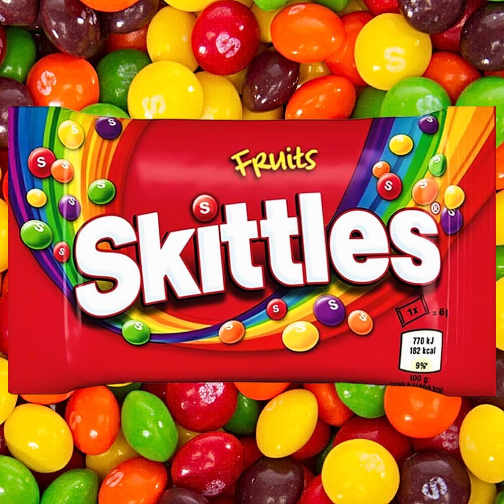 Skittle Fruits bag on top of loose sweets, multicoloured