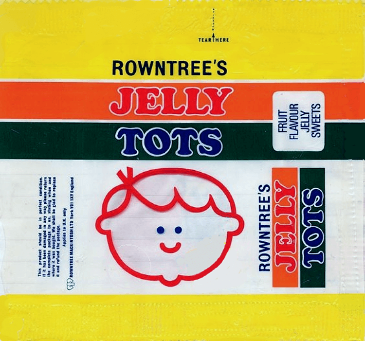 Old Rowntree's Jelly Tots wrapper, yellow with orange and green stripes and a red smiley child's face